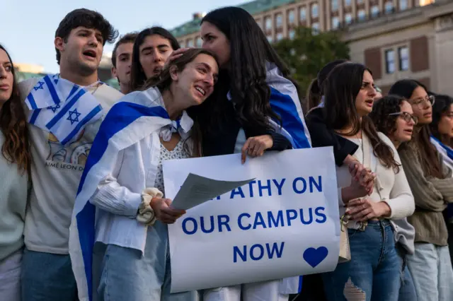 Columbia students participate in a rally and vigil in support of Israel in response to a neighbouring student rally in support of Palestine at the university