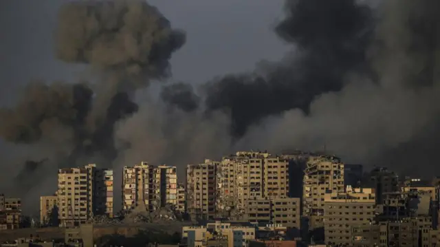 Smoke rises from an explosion after rockets were launched from the coast of the Gaza Strip