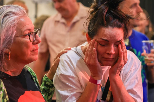 A Yes supporter reacts at the Inner West for 'Yes2023' official referendum function at Wests Ashfield Leagues Club on October 14, 2023 in Sydney, Australia.