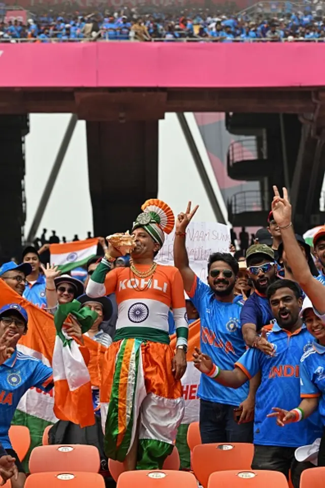 India fans cheer before the start of the 2023 ICC Men's Cricket World Cup one-day international (ODI) match between India and Pakistan