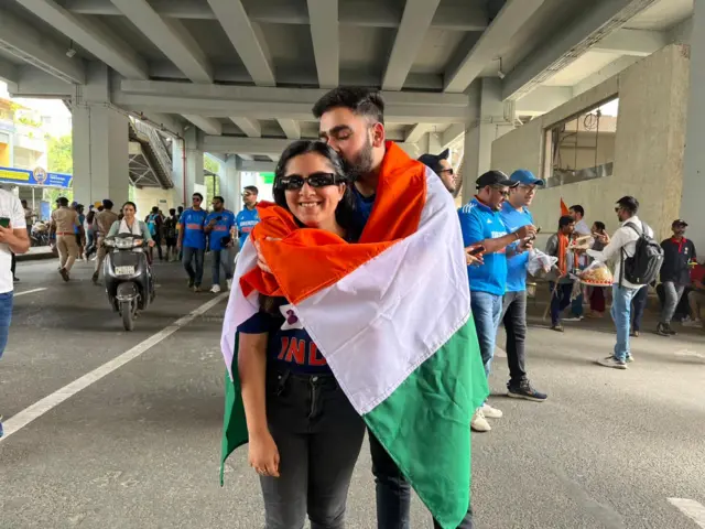 Pranav and Monica outside the stadium