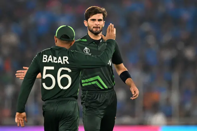 Shaheen Afridi and Babar Azam celebrate the wicket of Rohit Sharma