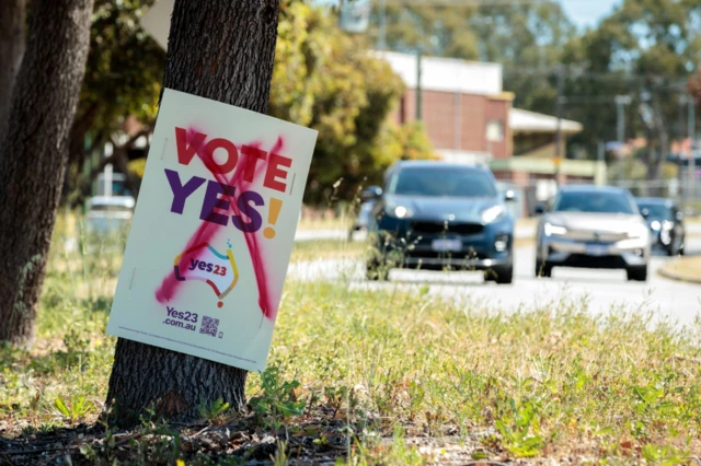 A defaced 'Vote Yes' sign is seen in Bassendean in Perth in Western Australia where polls have not yet closed