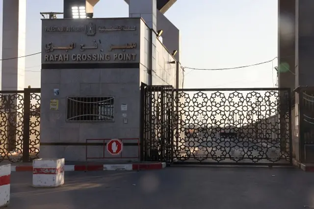 A picture taken on October 10, 2023, shows the closed gates of the Rafah border crossing with Egypt.