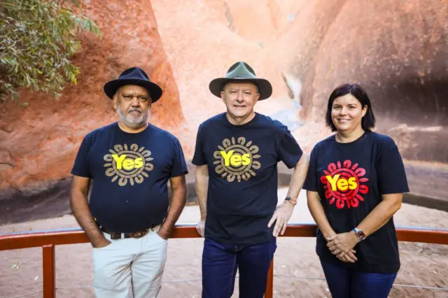 Australian Prime Minister Anthony Albanese (C) stands with Indigenous rights activist Noel Pearson (R) and Northern Territory Chief Minister Natasha Fyles