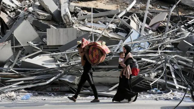 Residents of Gaza City have a few belongings gathered as they begin to evacuate