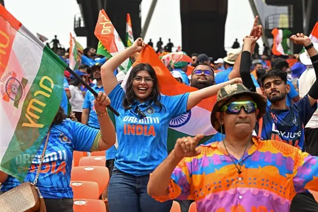 Indian fans cheer before the start of the 2023 ICC Men's Cricket World Cup one-day international (ODI) match between India and Pakistan