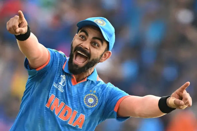 Virat Kohli celebrates a wicket