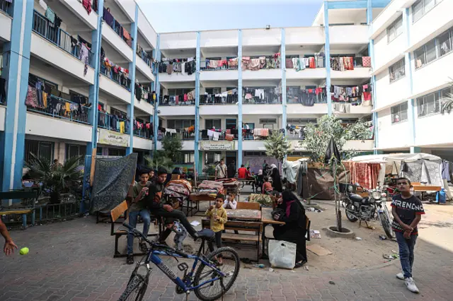 Palestinians fleeing Israeli attacks take shelter at UNRWA school in Khan Younis, Gaza