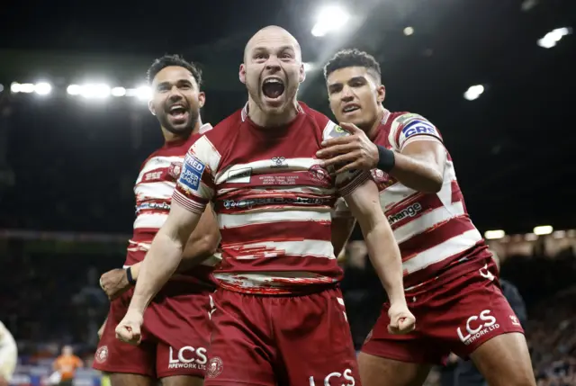 Liam Marshall celebrates his try against Catalans