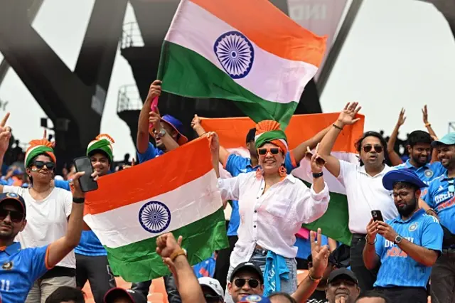 India fans cheer before the start of the 2023 ICC Men's Cricket World Cup one-day international (ODI) match between India and Pakistan