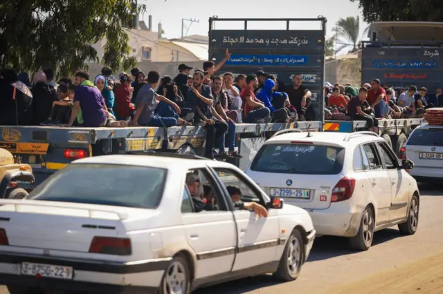 Palestinians with their belongings leave Gaza City as they flee from their homes following the Israeli army's warning on October 13, 2023