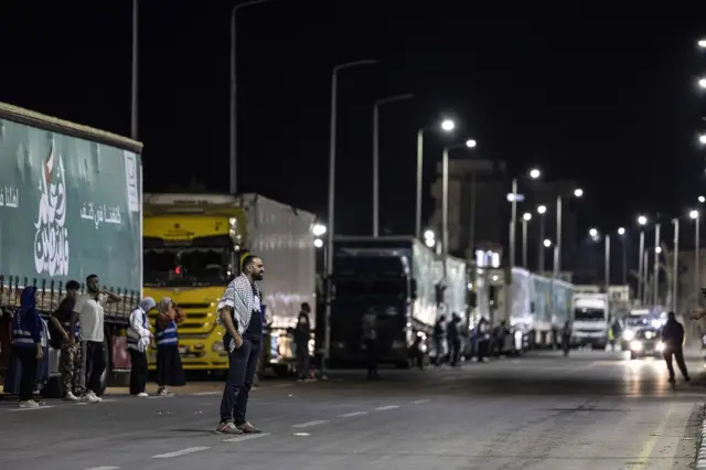 An aid convoy queues at the Rafah crossing between Egypt and Gaza