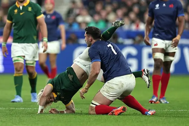 South Africa's scrum-half Faf de Klerk is tackled by France's flanker Charles Ollivon