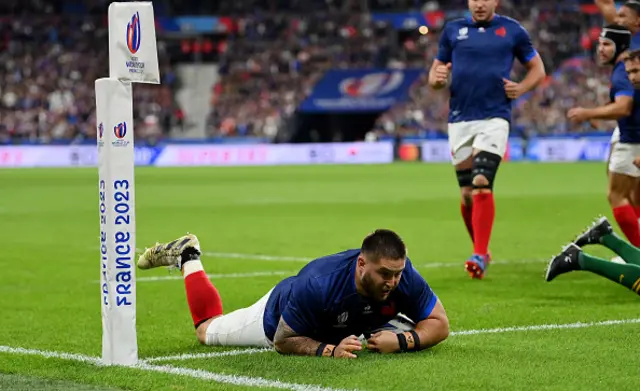 Cyril Baille of France scores a try