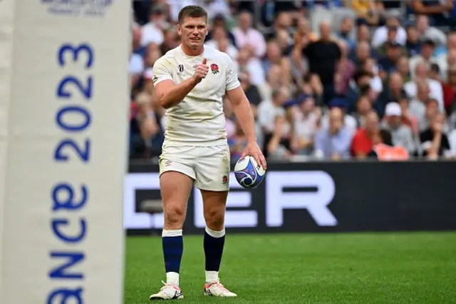 England's fly-half Owen Farrell reacts with a thumbs up