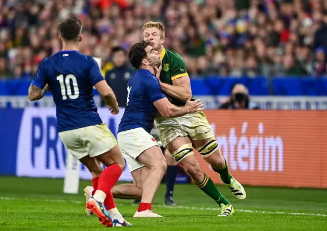 Pieter-Steph Du Toit of South Africa is tackled by Damien Penaud