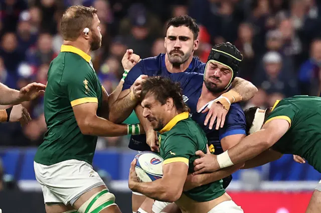 South Africa's lock Eben Etzebeth is tackled by France's number eight Gregory Alldritt