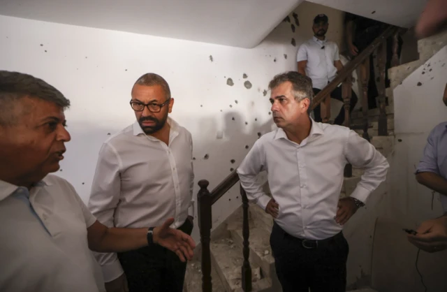 James Cleverly visits the Ofakim house of David and Rachel Edri who survived a 20-hour hostage situation during the Hamas attack in southern Israel