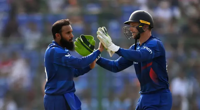 Adil Rashid and Jos Buttler celebrate a wicket