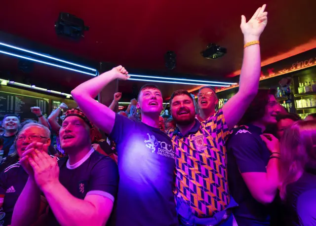 The Tartan Army in Lille celebrate after Spain's success in Oslo