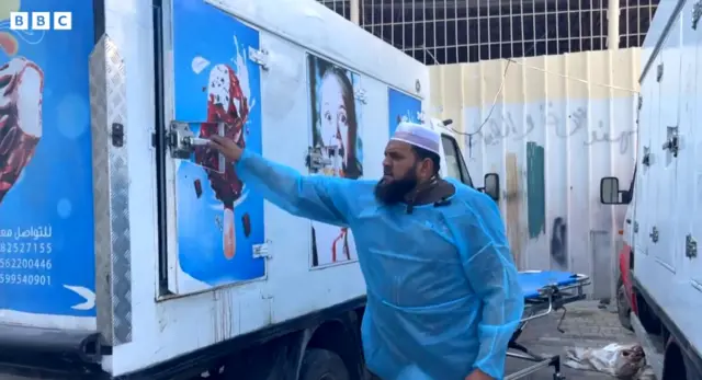 Yasser Khattab in front of an ice cream van housing bodies