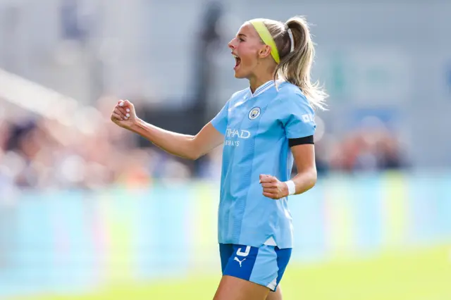 Chloe Kelly celebrates her goal v Chelsea with a fist pump.