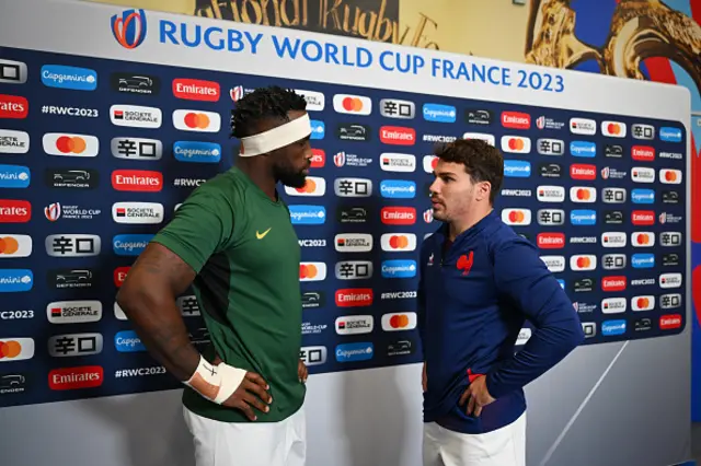 Captains Siya Kolisi of South Africa and Antoine Dupont of France interact