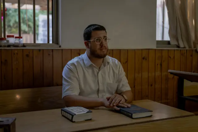 Baroch Frankel, a 28-year-old volunteer sits