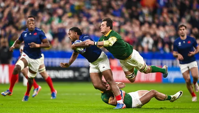 Peato Mauvaka of France is tackled by Jesse Kriel, and Franco Mostert