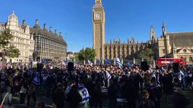 Hundreds of people attend a vigil for Israel in London's Parliament Square