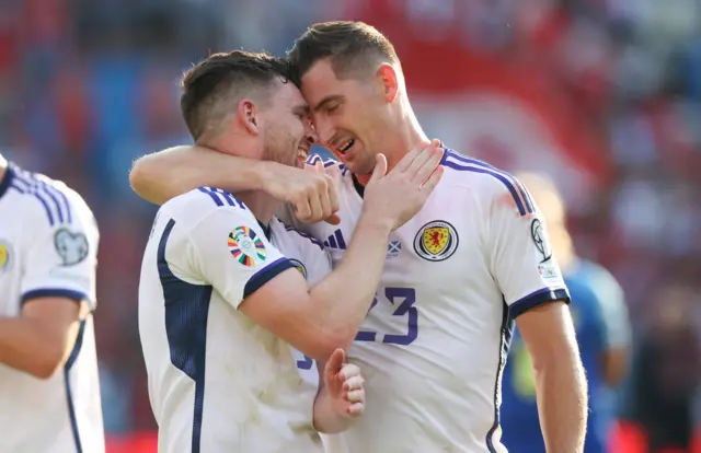 Andy Robertson celebrating with Kenny McLean