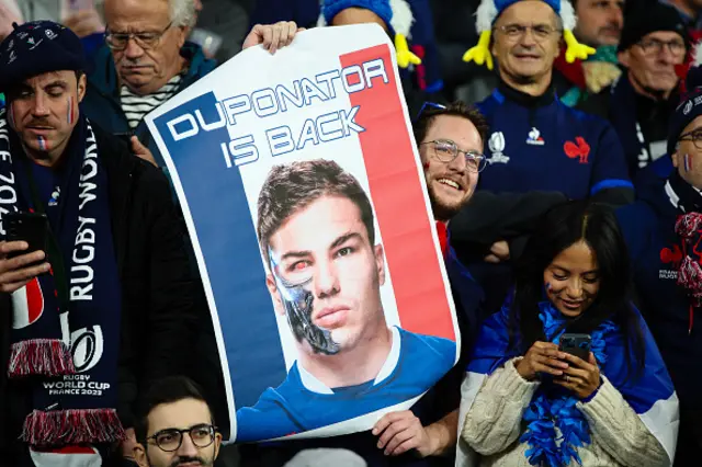 Fan holds Dupont poster