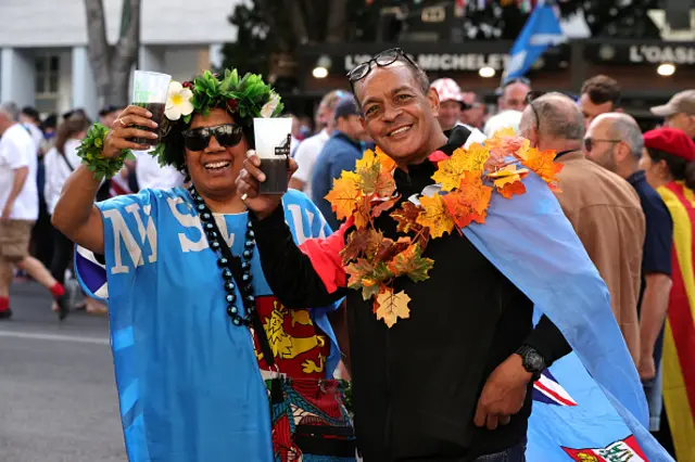 Fans of Fiji pose for a photo