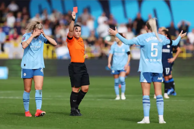 Greenwood is shown a red card by Emily Heaslip.