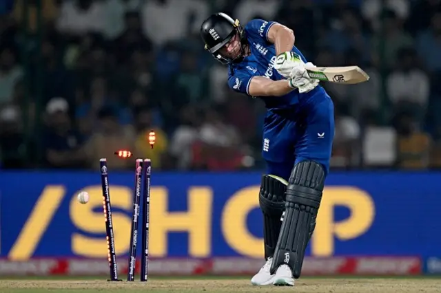 England's captain Jos Buttler is clean bowled