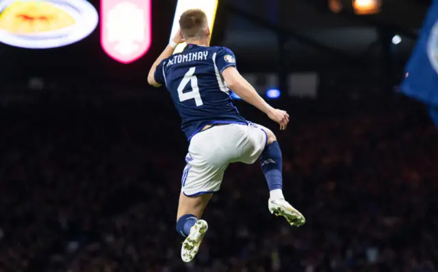 Scott McTominay jumping high in celebration