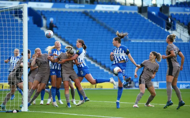 Elisabeth Terland of Brighton & Hove Albion heads the ball and scores