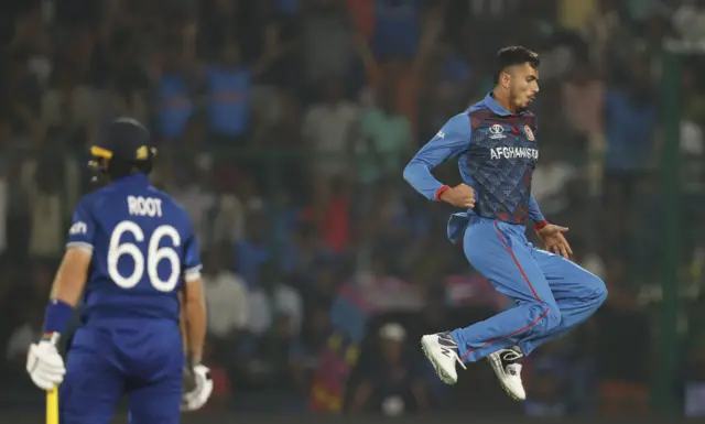 Mujeeb Ur Rahman celebrates the wicket of Joe Root