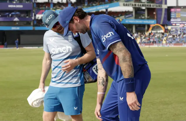 Reece Topley receives attention from the England medical staff