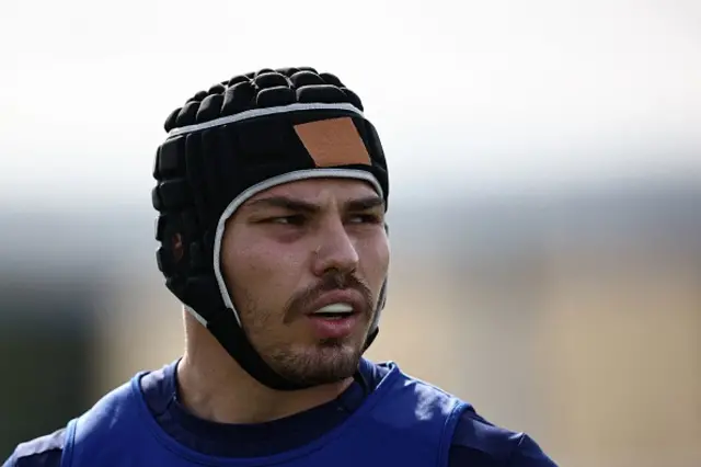 Antoine Dupont in training wearing a scrum cap