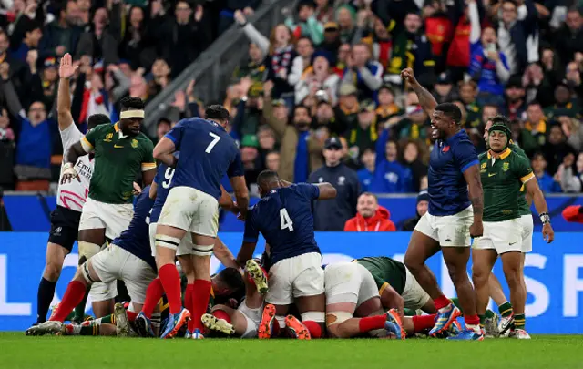 Cyril Baille of France (obscured) scores his team's third try