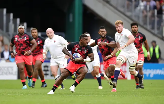 Josua Tuisova of Fiji runs with the ball