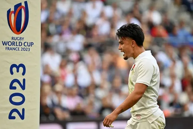 England's fly-half Marcus Smith reacts during the game