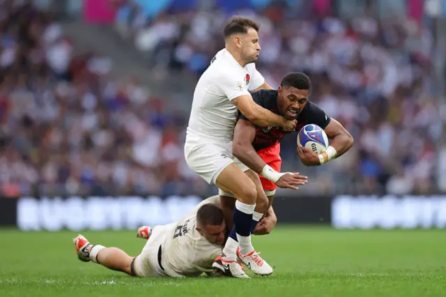 Ilaisa Droasese of Fiji is tackled by Danny Care and Ben Earl