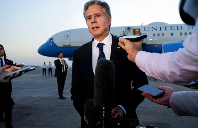 U.S. Secretary of State Antony Blinken speaks to members of the media before leaving Cairo