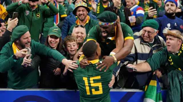 South Africa's Damian Willemse with fans after his team stunned France in the Rugby World Cup quarter-final