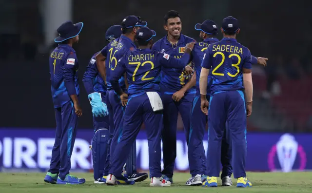 Chamika Karunaratne of Sri Lanka celebrates the run out wicket of Mitchell Marsh of Australia during the ICC Men's Cricket World Cup India 2023 between Australia and Sri Lanka