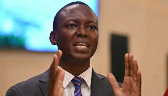 Succès Masra, the president of Chadian opposition party "Les Transformateurs" (The Transformers) gestures during a briefing after a meeting with representatives of the African Union mission on May 3, 2021 in N'djamena in Chad. (