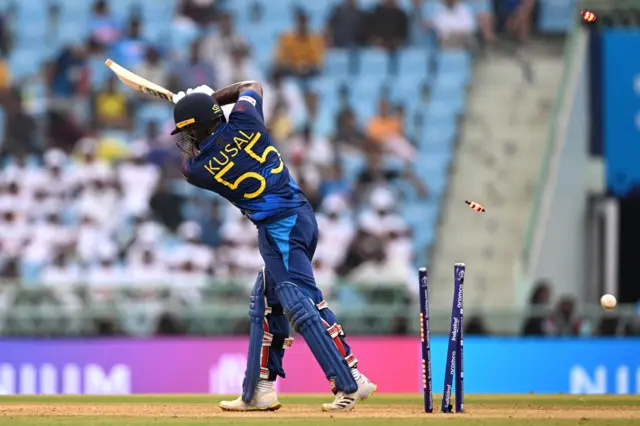 Kusal Perera is bowled by Pat Cummins